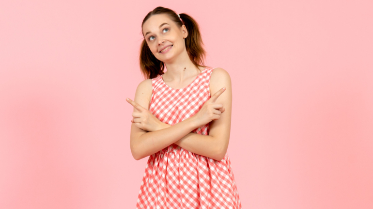 young-girl-cute-pink-dress-with-dreaming-expression-pink